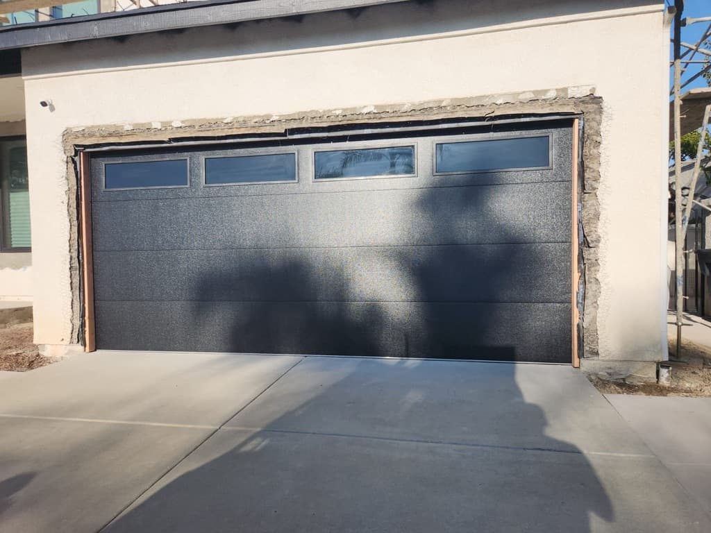 Tigerwood horizontal-slat garage door with black windows, Linda Vista