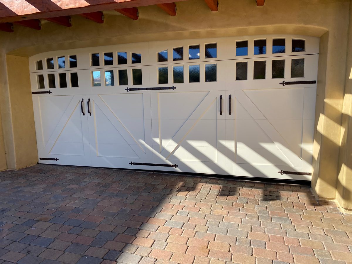 Black full-view glass garage door on a Spanish-style home, Talmadge