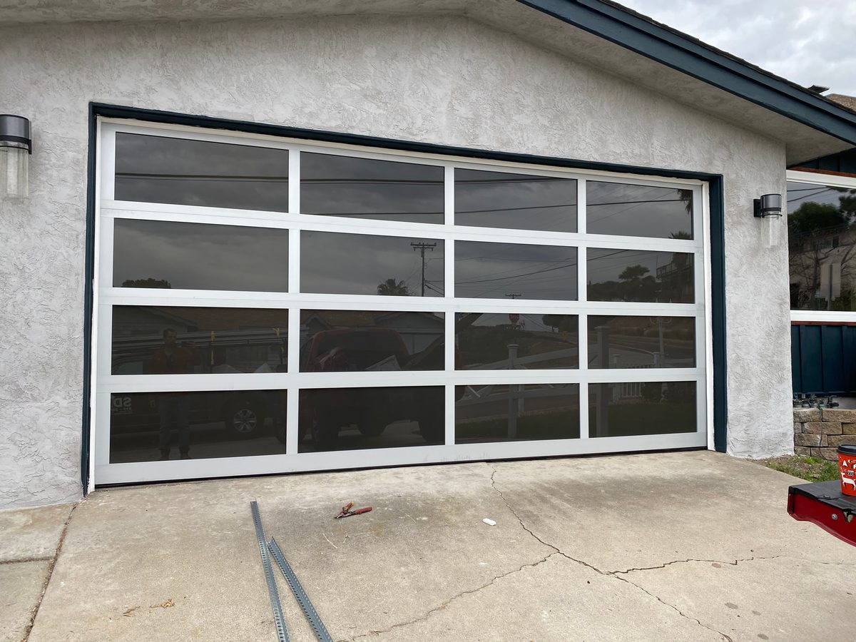 Black modern flush garage door with side windows, Bay Park