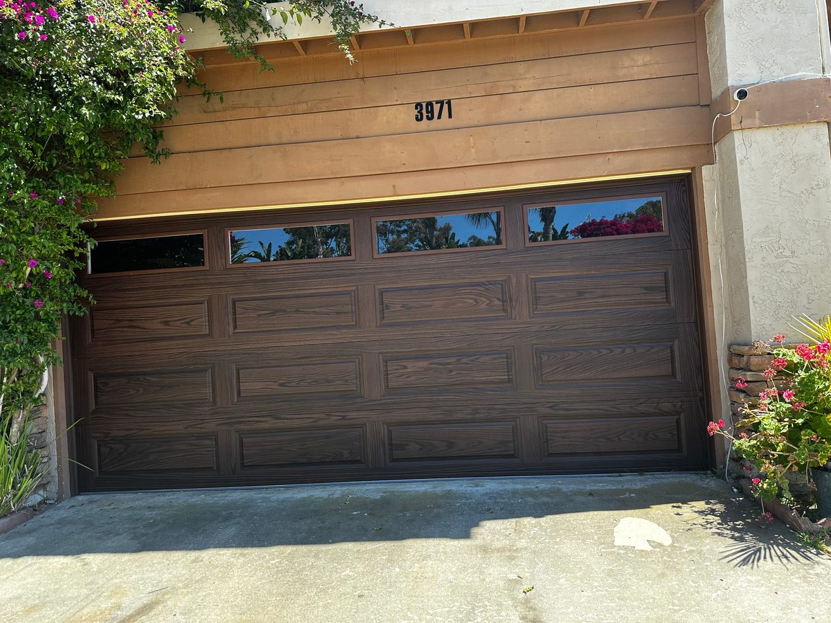 Black full-view glass garage door on a coastal home, Pacific Beach