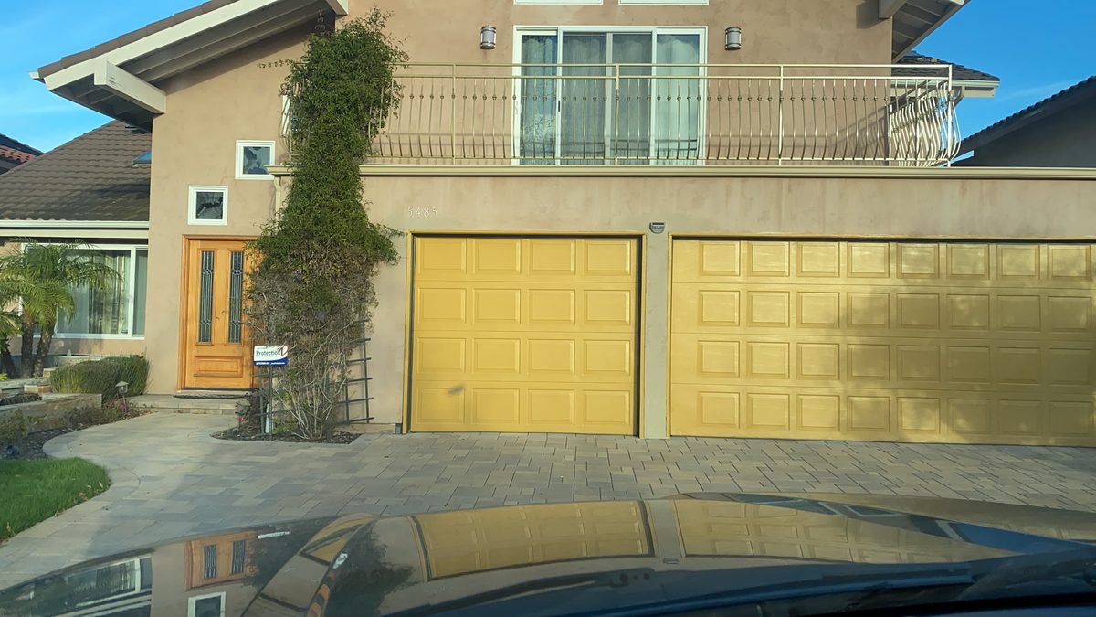 Walnut wood-look raised-panel garage door with windows, Carmel Valley