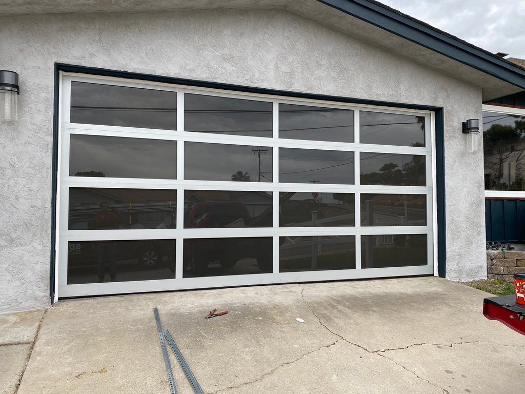 White-frame full-view glass garage door, Bay Park